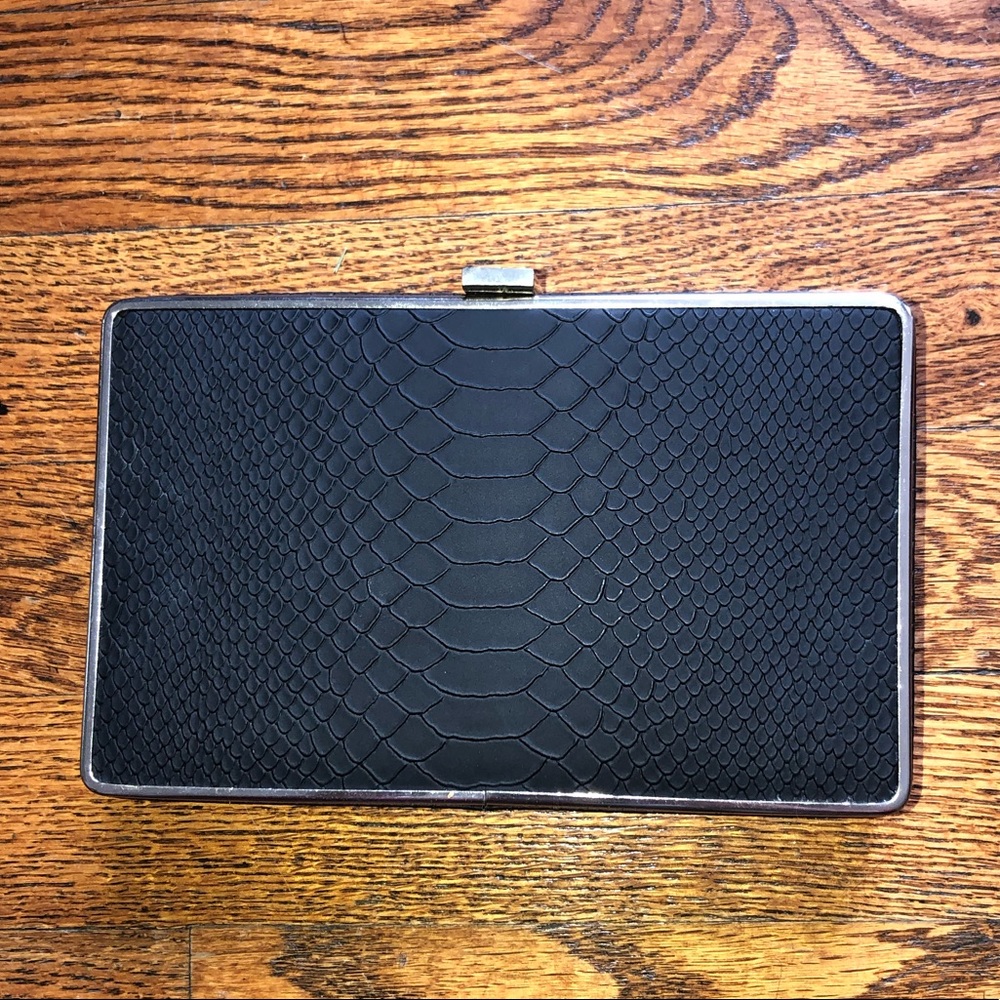 BCBG black and gold snakeskin clutch